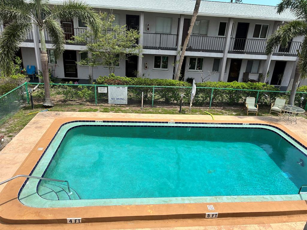 3101 Bee Ridge Road, Unit 214 Sarasota, FL 34239 - Photo 9 of 9 a view of a house with a swimming pool