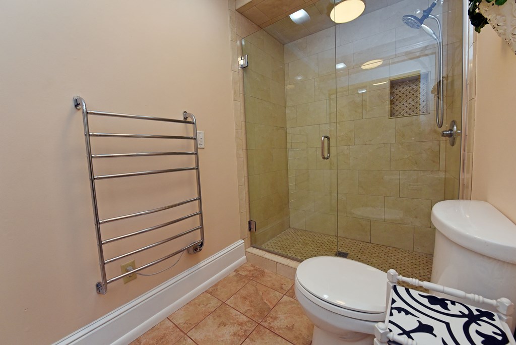 63 Loving Road Morganton, GA 30560 - Photo 38 of 58 a bathroom with a toilet and a shower