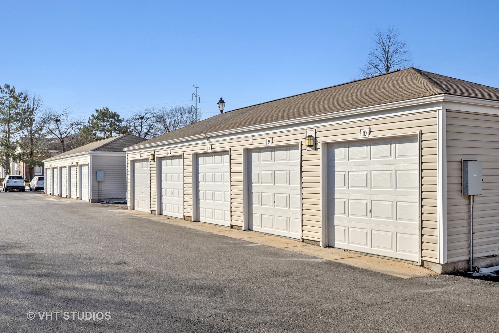 1919 Brookdale Road, Unit 209 Naperville, IL 60563 - Photo 14 of 53 a view of an house with backyard and parking