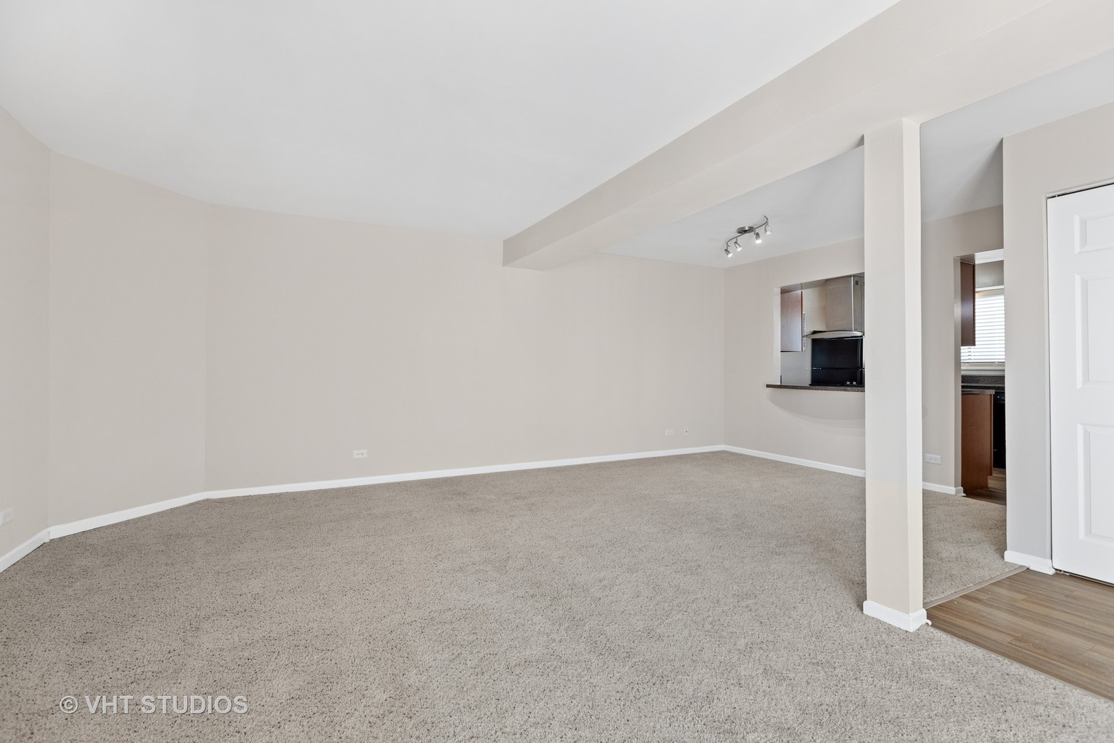 1919 Brookdale Road, Unit 209 Naperville, IL 60563 - Photo 23 of 53 an empty room with an entrance to other room