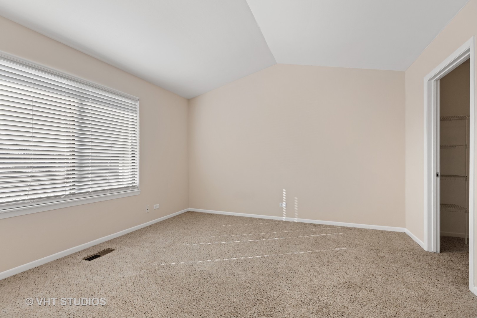1919 Brookdale Road, Unit 209 Naperville, IL 60563 - Photo 37 of 53 an empty room with a window