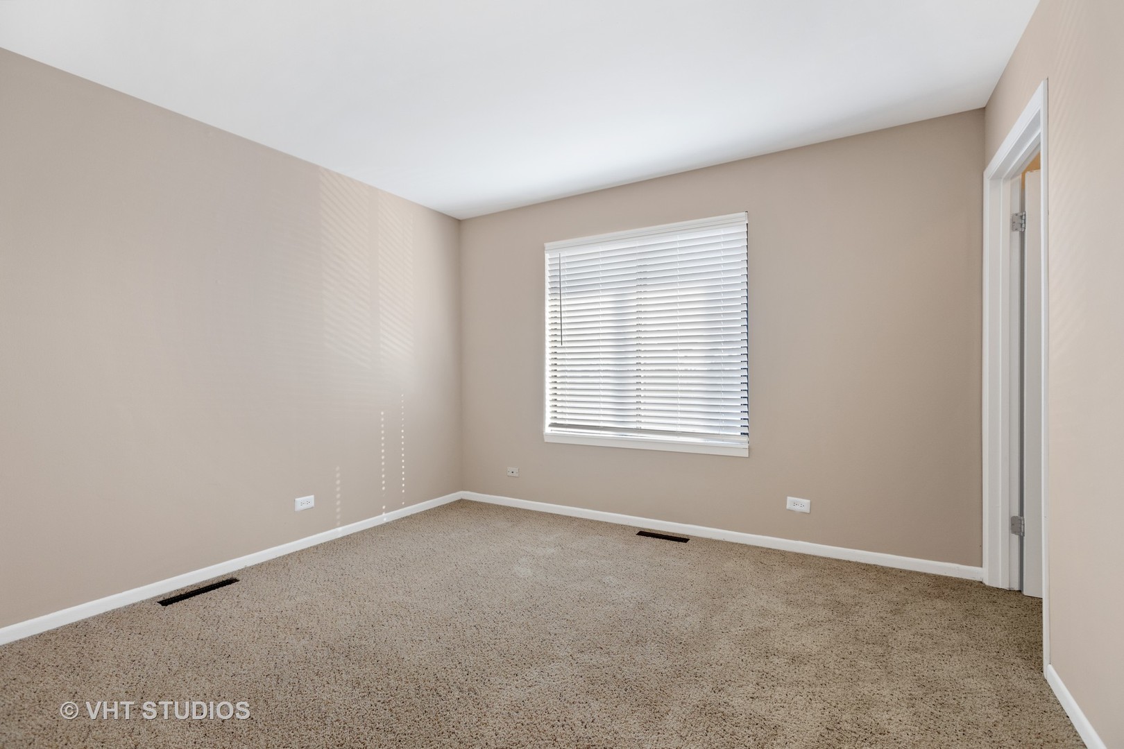 1919 Brookdale Road, Unit 209 Naperville, IL 60563 - Photo 43 of 53 an empty room with windows