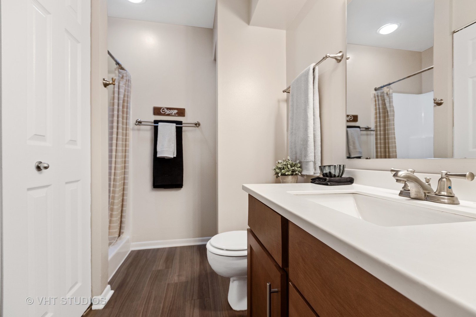 1919 Brookdale Road, Unit 209 Naperville, IL 60563 - Photo 47 of 53 a bathroom with a sink a toilet a mirror and shower