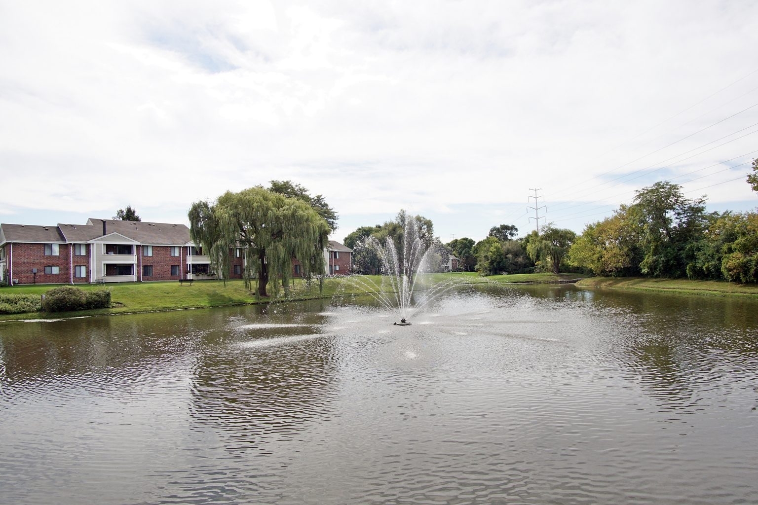 1919 Brookdale Road, Unit 209 Naperville, IL 60563 - Photo 8 of 53 a view of a lake with houses