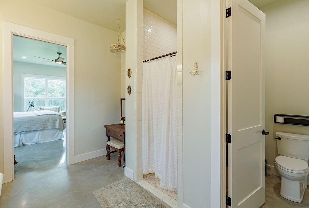 2094 Jim Harry Loop Sunset, TX 76270 - Photo 15 of 40 primary bathroom with notched out space for make-up vanity