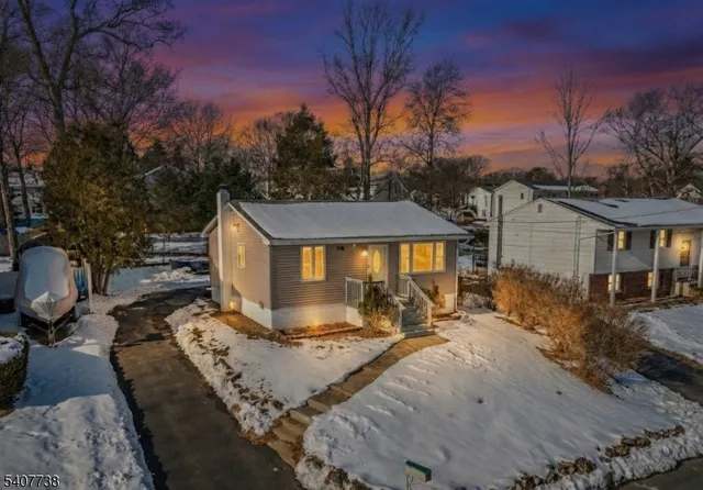 a front view of house with yard outdoor seating and barbeque oven