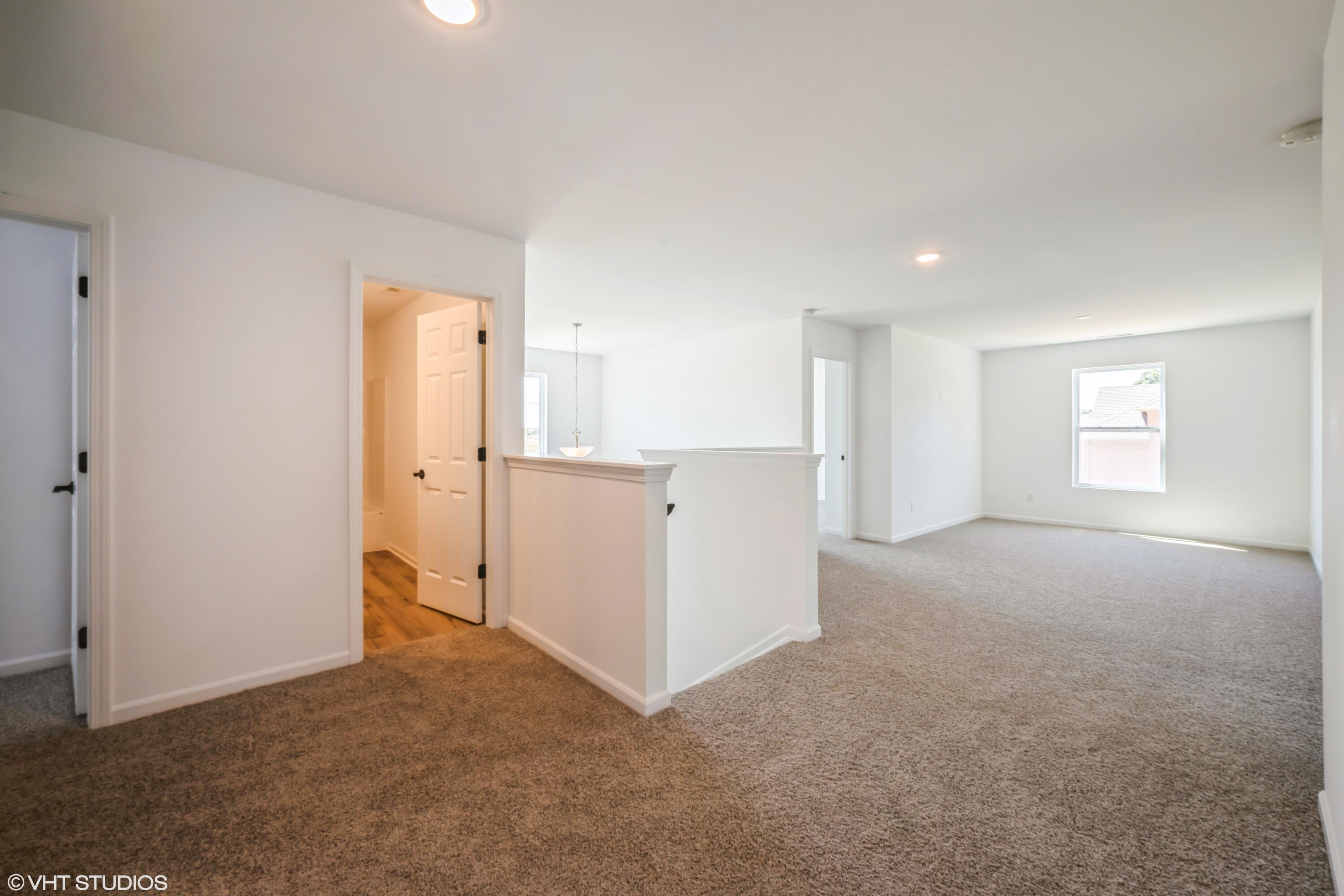 10344 Nevada Place Crown Point, IN 46307 - Photo 15 of 23 an empty room with windows and refrigerator