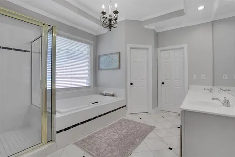a bathroom with a tub and a shower