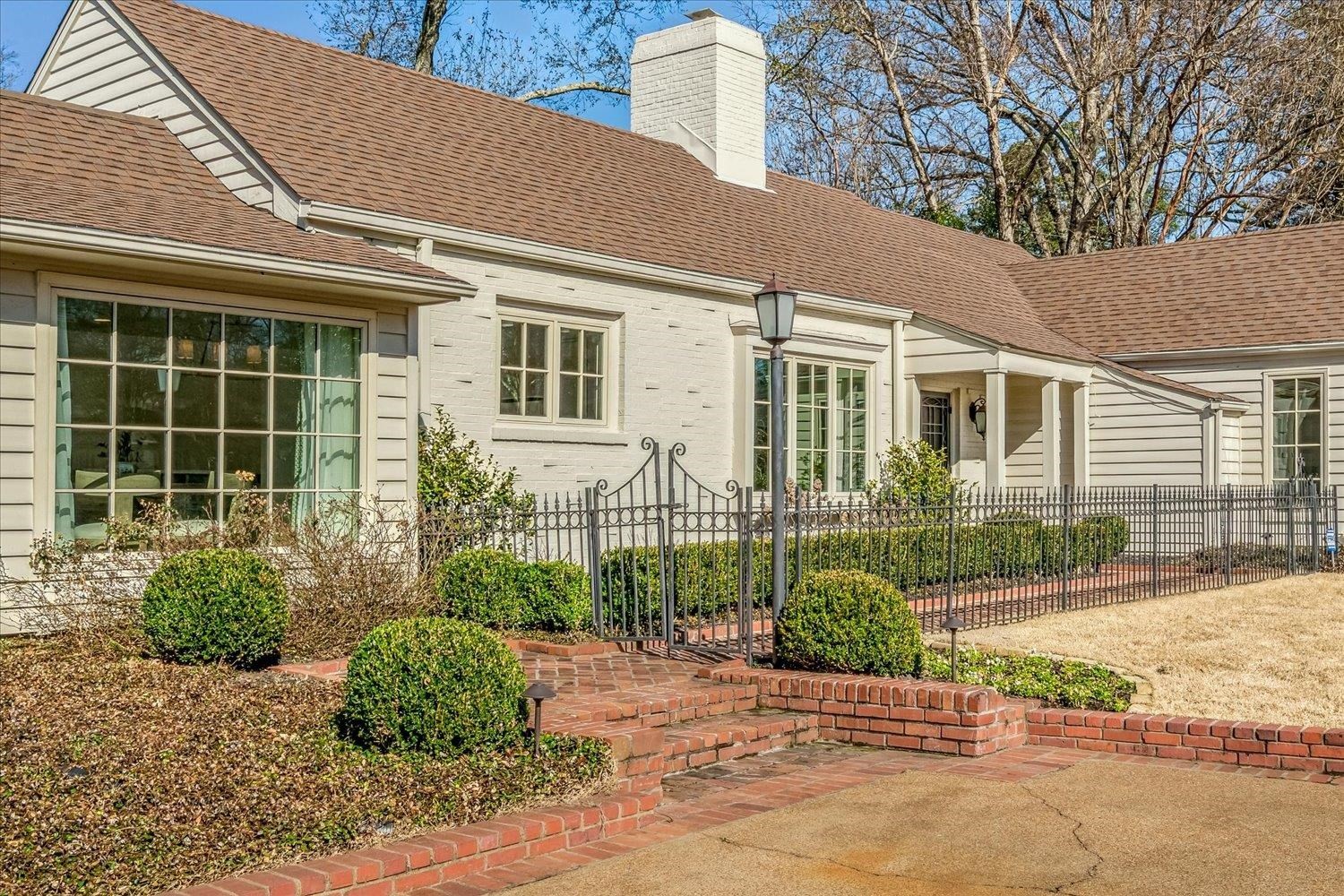 4160 Tuckahoe Road Memphis, TN 38117 - Photo 3 of 39 a front view of a house with garden