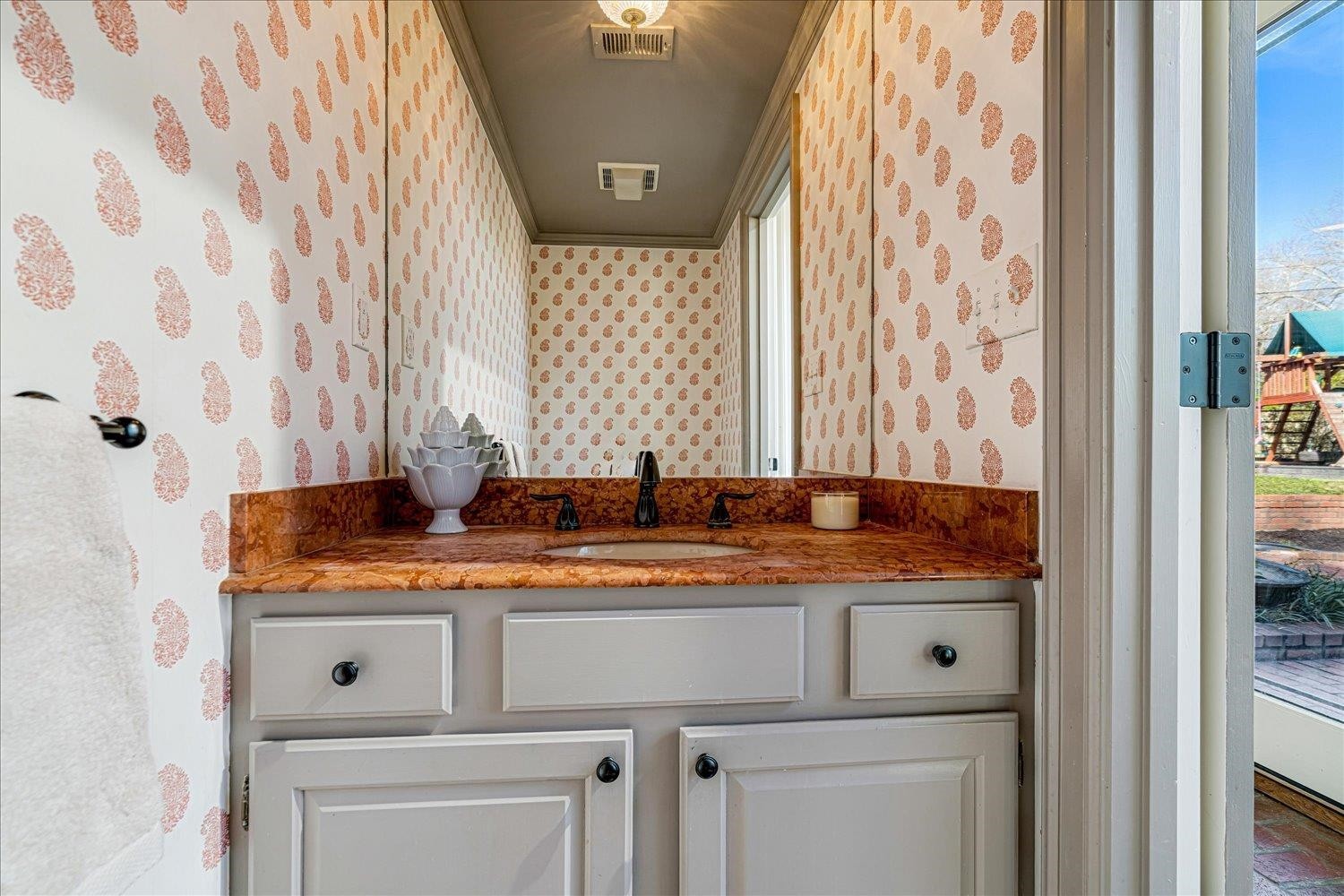 4160 Tuckahoe Road Memphis, TN 38117 - Photo 32 of 39 a bathroom with a granite countertop sink and a mirror