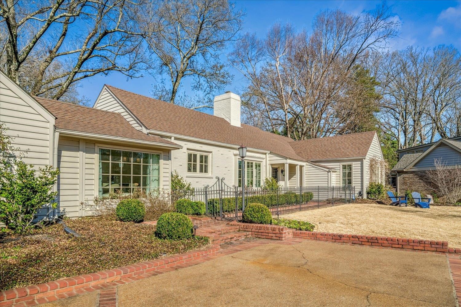 4160 Tuckahoe Road Memphis, TN 38117 - Photo 4 of 39 a front view of a house with a yard and potted plants