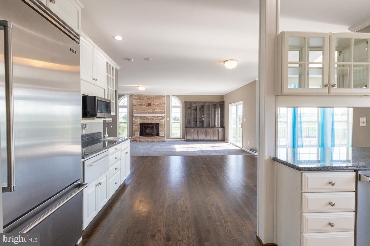 9630 Clemsonville Road Union Bridge, MD 21791 - Photo 16 of 70 a large kitchen with cabinets and stainless steel appliances