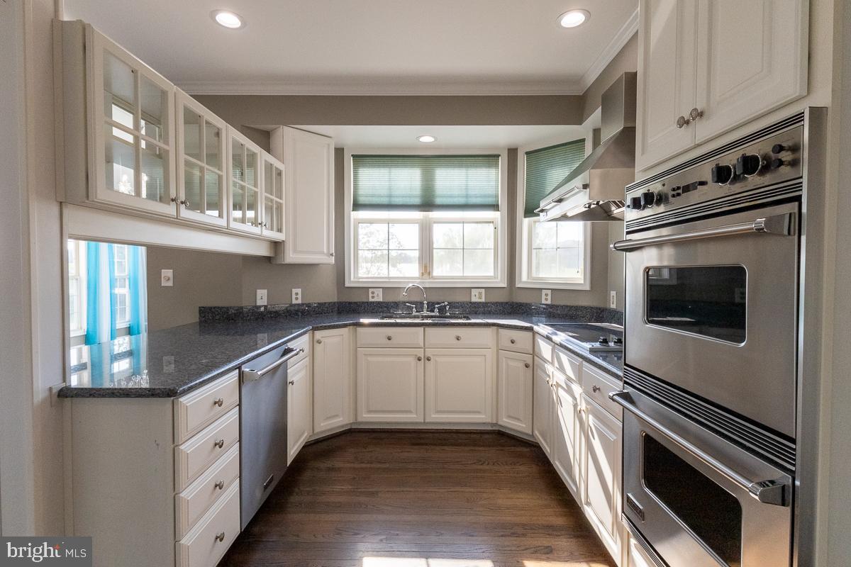 9630 Clemsonville Road Union Bridge, MD 21791 - Photo 18 of 70 a kitchen with stainless steel appliances granite countertop a stove and a sink