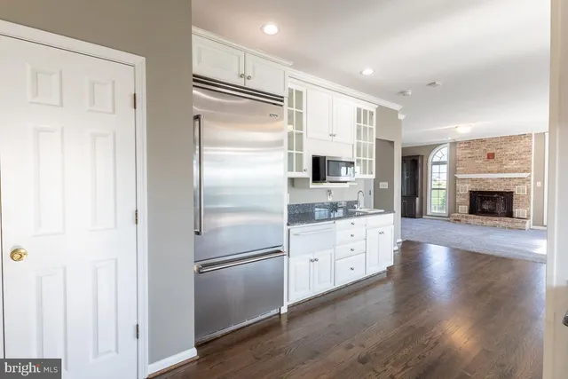 a view of a storage and utility room with washer and dryer