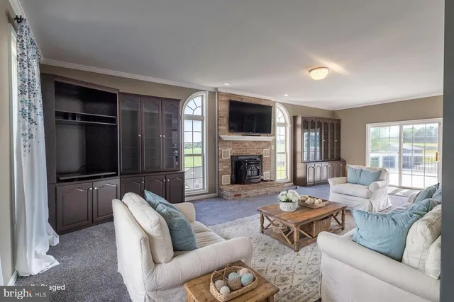 a living room with furniture fireplace and a flat screen tv