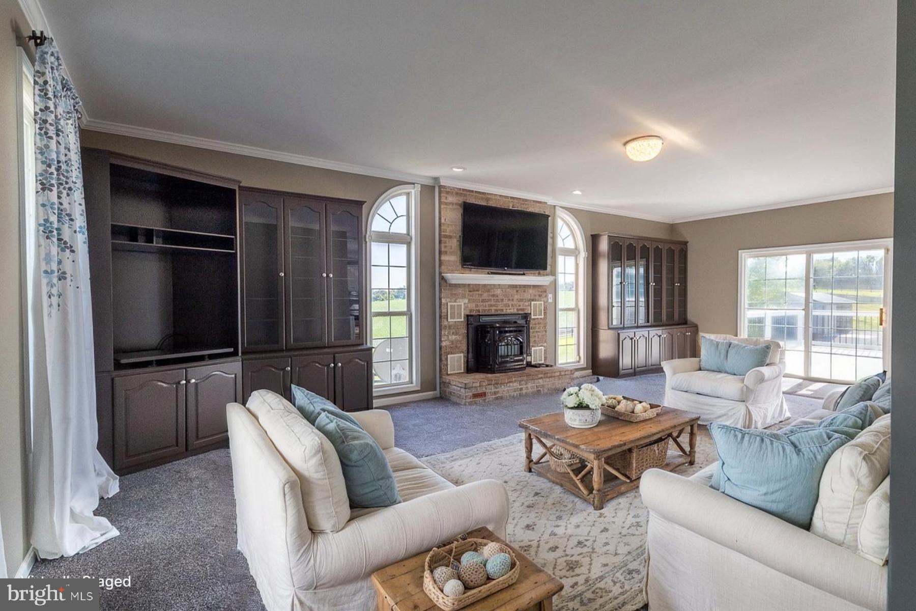 9630 Clemsonville Road Union Bridge, MD 21791 - Photo 2 of 70 a living room with furniture fireplace and a flat screen tv