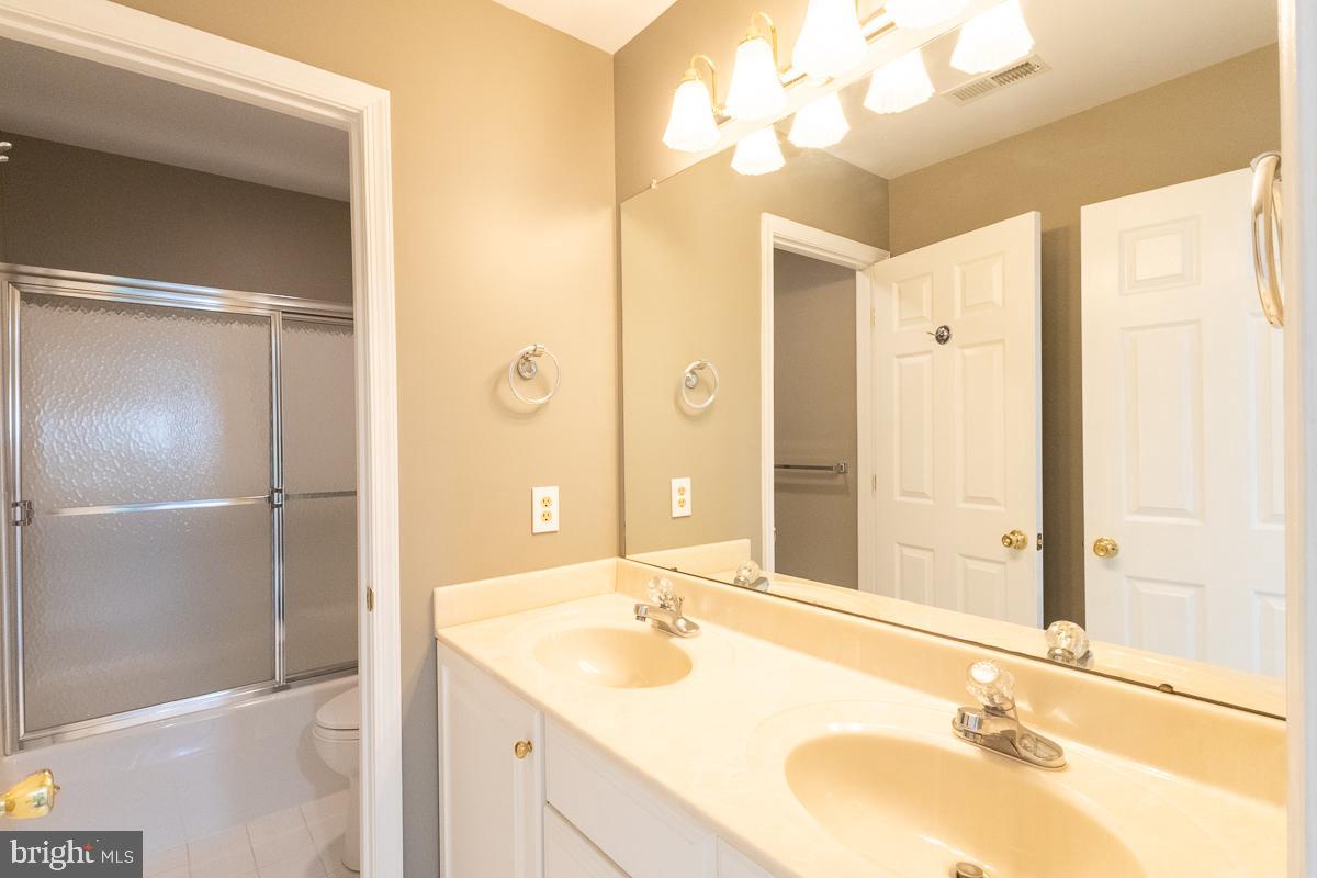 9630 Clemsonville Road Union Bridge, MD 21791 - Photo 24 of 70 a bathroom with a sink and a mirror