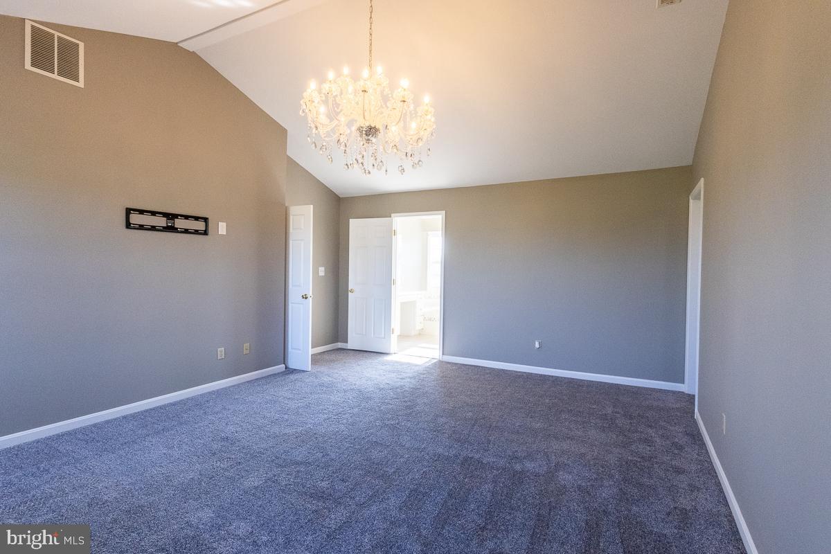 9630 Clemsonville Road Union Bridge, MD 21791 - Photo 29 of 70 a view of an empty room with a chandelier
