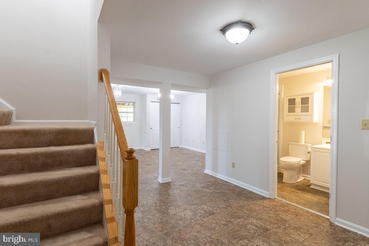 9630 Clemsonville Road Union Bridge, MD 21791 - Photo 41 of 70 a view of entryway with wooden floor and stairs