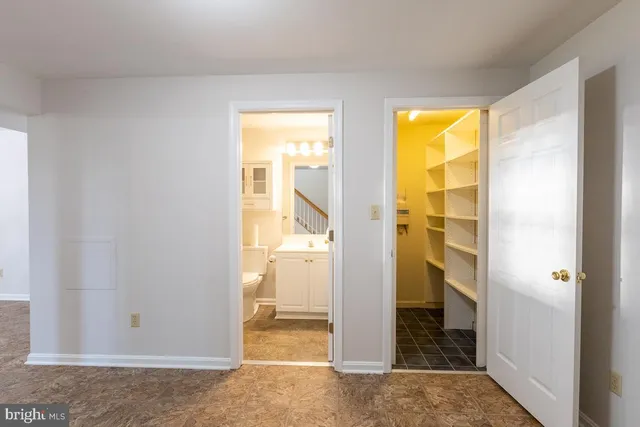 a kitchen with furniture and a window