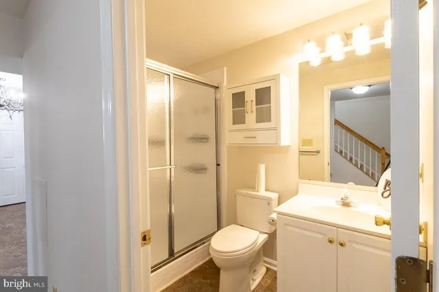 a bedroom with a bed a desk and chair