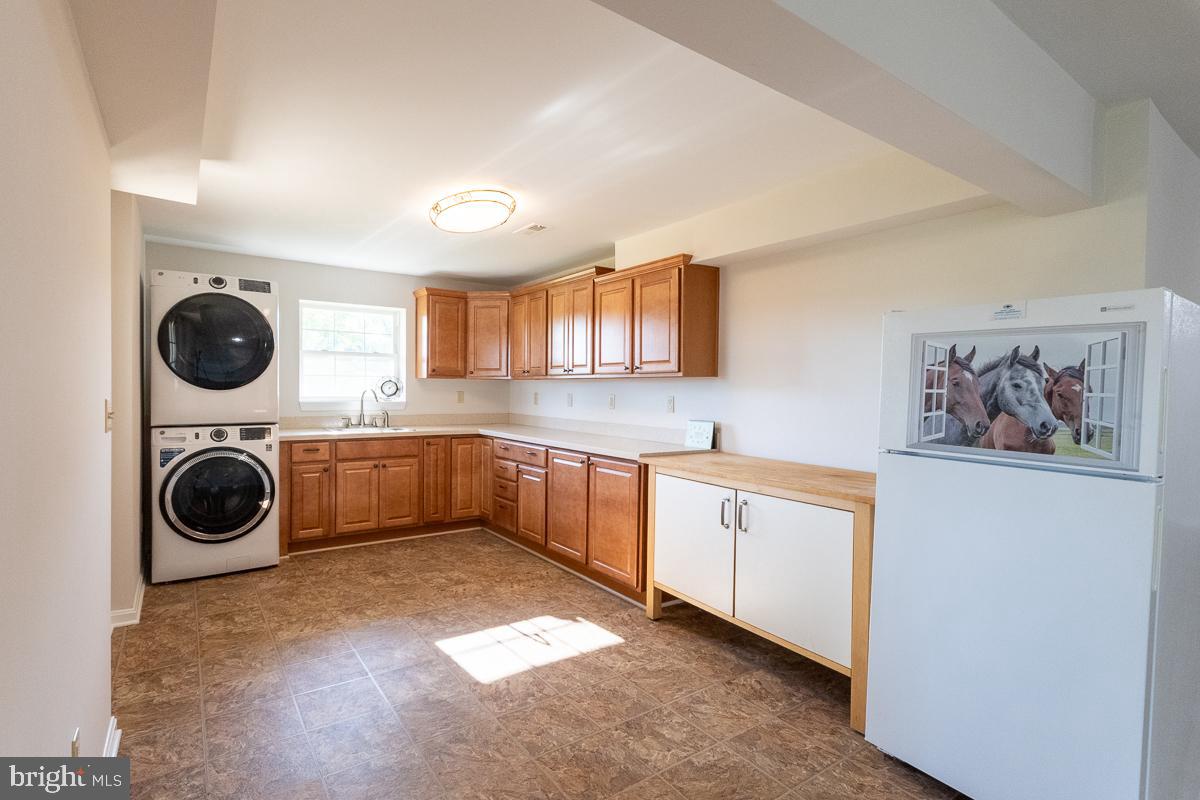 9630 Clemsonville Road Union Bridge, MD 21791 - Photo 46 of 70 a kitchen with a stove top oven sink and cabinets