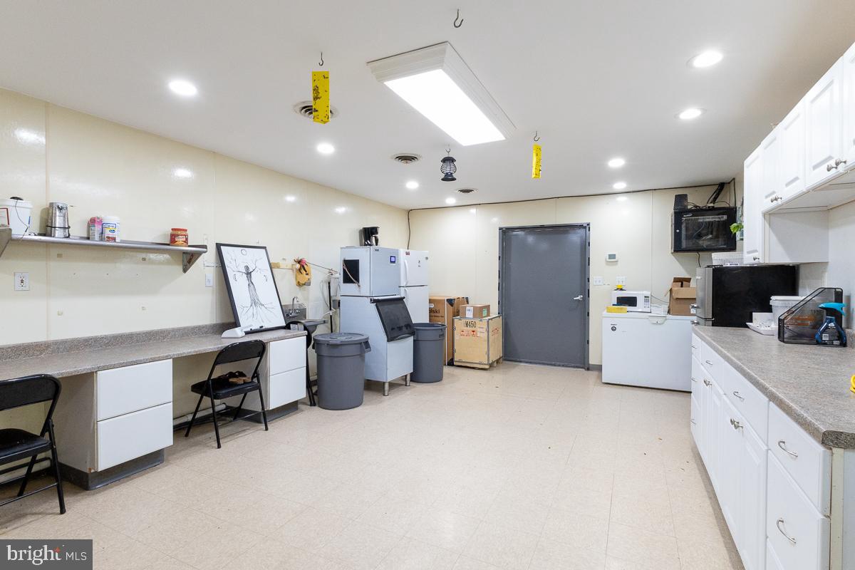 9630 Clemsonville Road Union Bridge, MD 21791 - Photo 58 of 70 a large white kitchen with lots of counter space