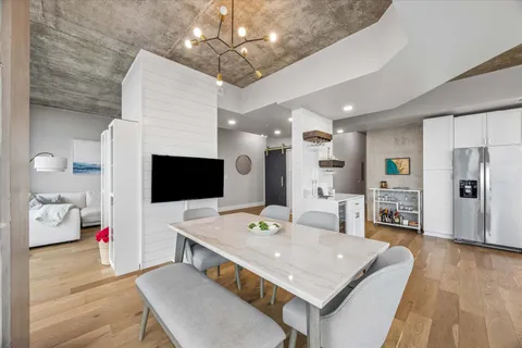 a view of a dining room with furniture and wooden floor
