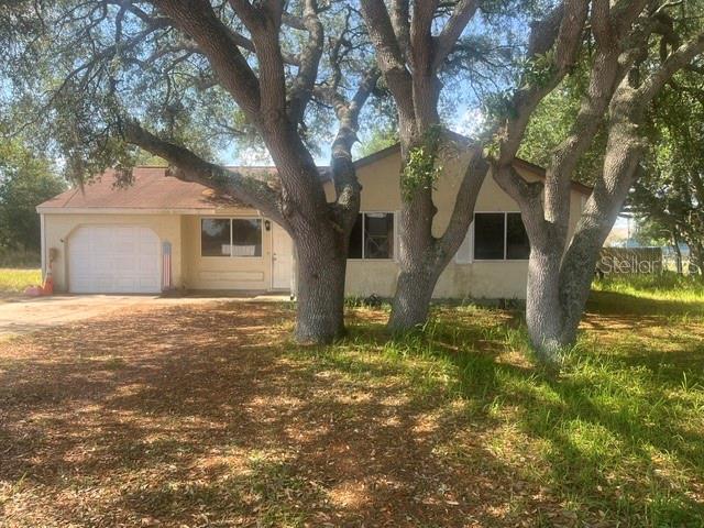 12 Pine Course Way Ocala, FL 34472 - Photo 2 of 29 a house that has a tree in front of it