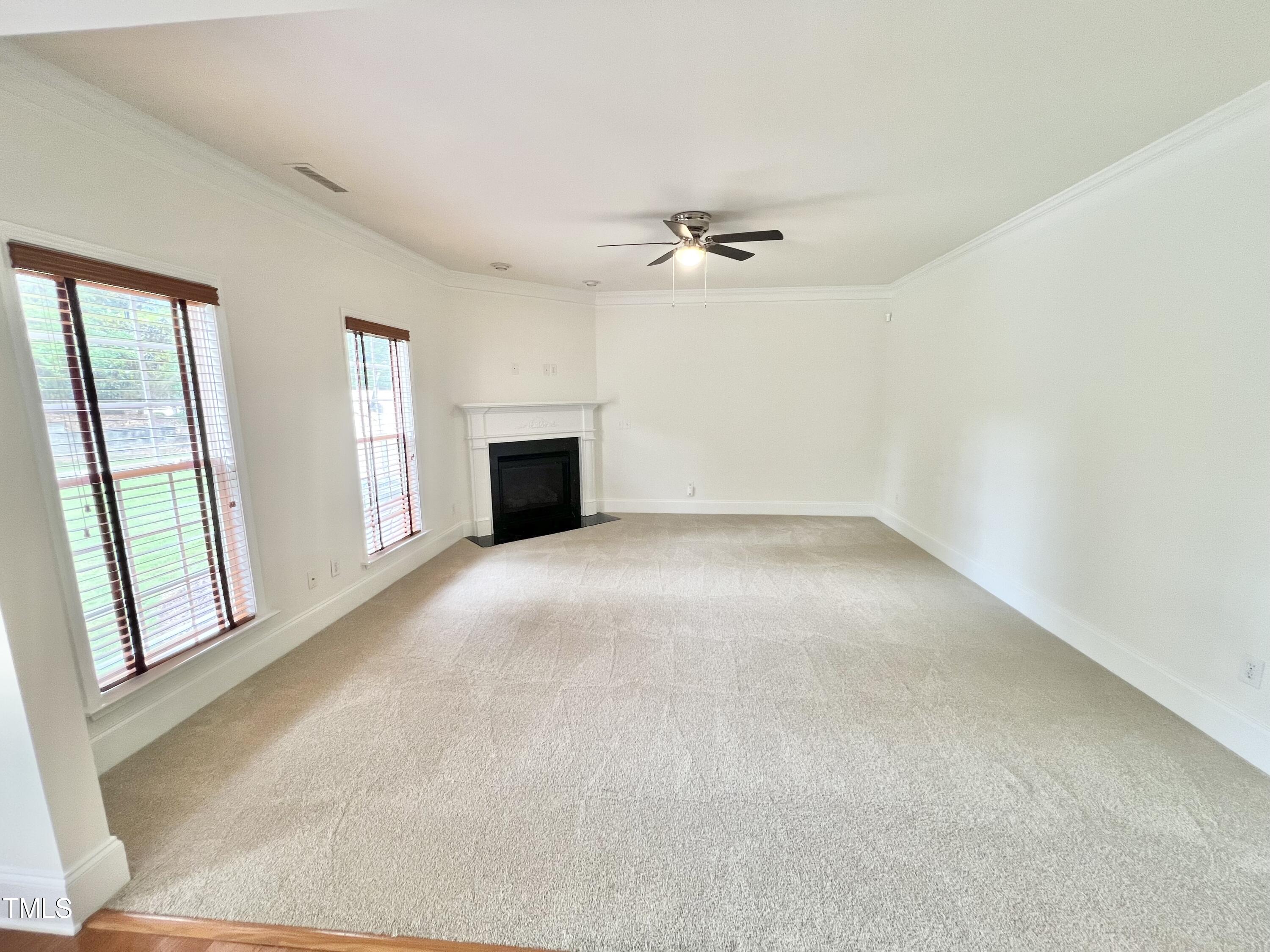 12221 Fox Valley Street Raleigh, NC 27614 - Photo 14 of 29 a view of empty room with a fireplace