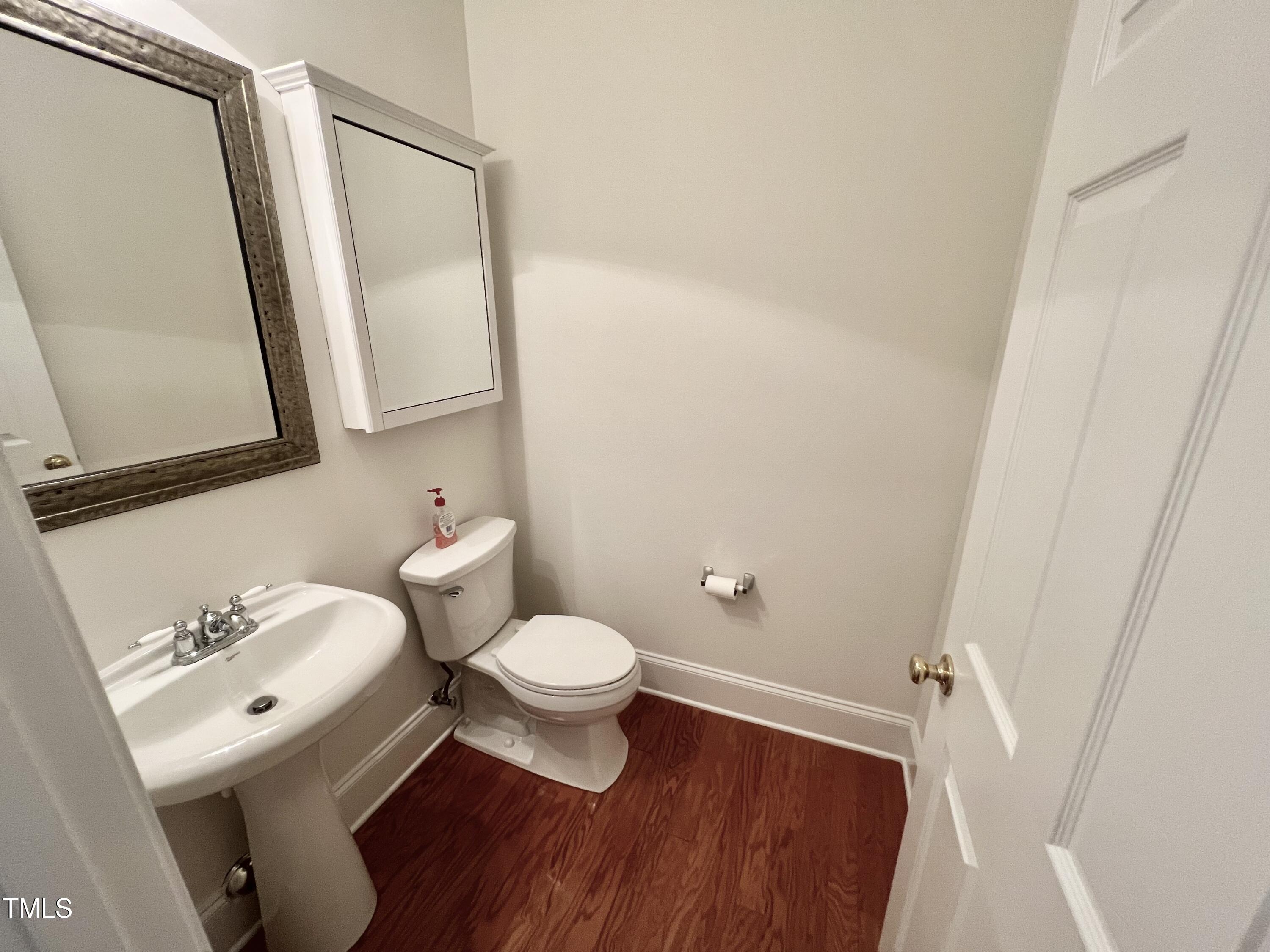 12221 Fox Valley Street Raleigh, NC 27614 - Photo 15 of 29 a bathroom with a sink and a mirror