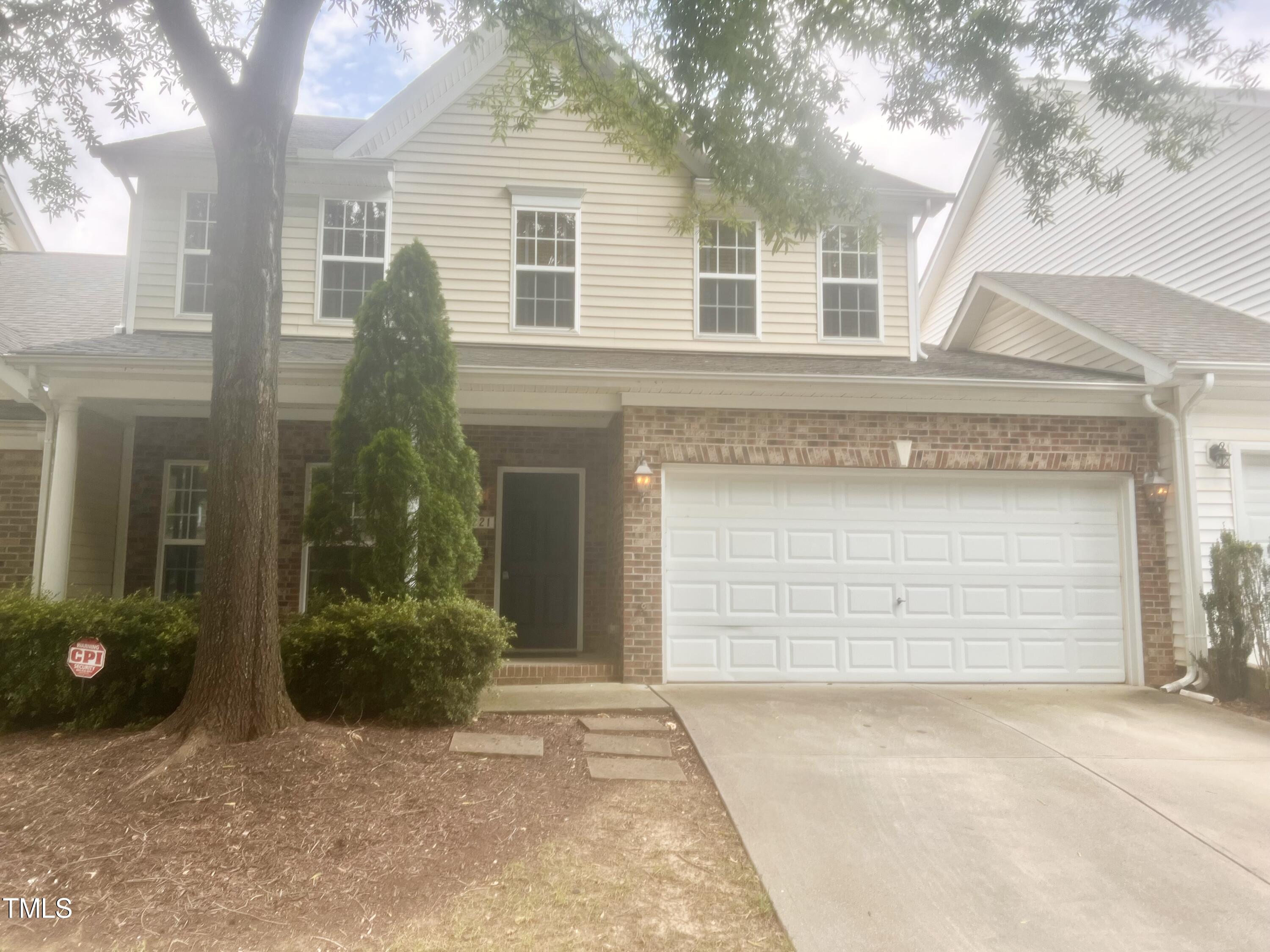 12221 Fox Valley Street Raleigh, NC 27614 - Photo 2 of 29 a front view of a house with a yard and garage