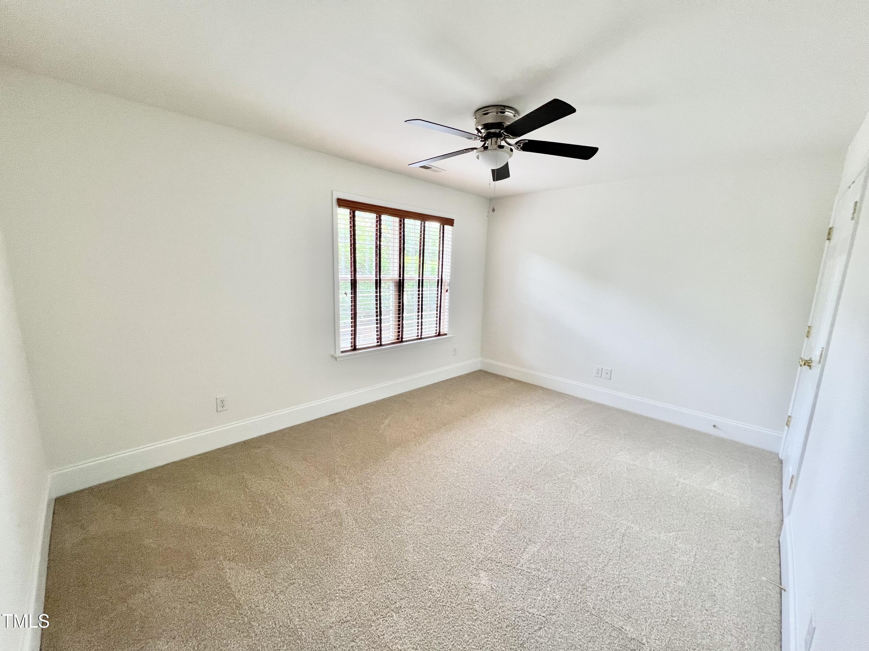 12221 Fox Valley Street Raleigh, NC 27614 - Photo 24 of 29 an empty room with windows and fan