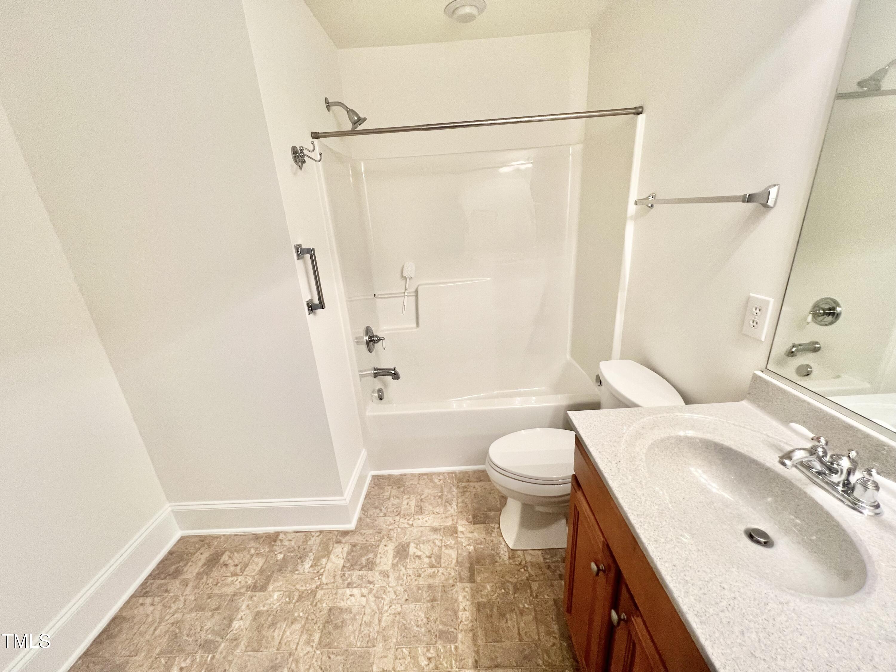 12221 Fox Valley Street Raleigh, NC 27614 - Photo 27 of 29 a bathroom with a sink toilet and shower