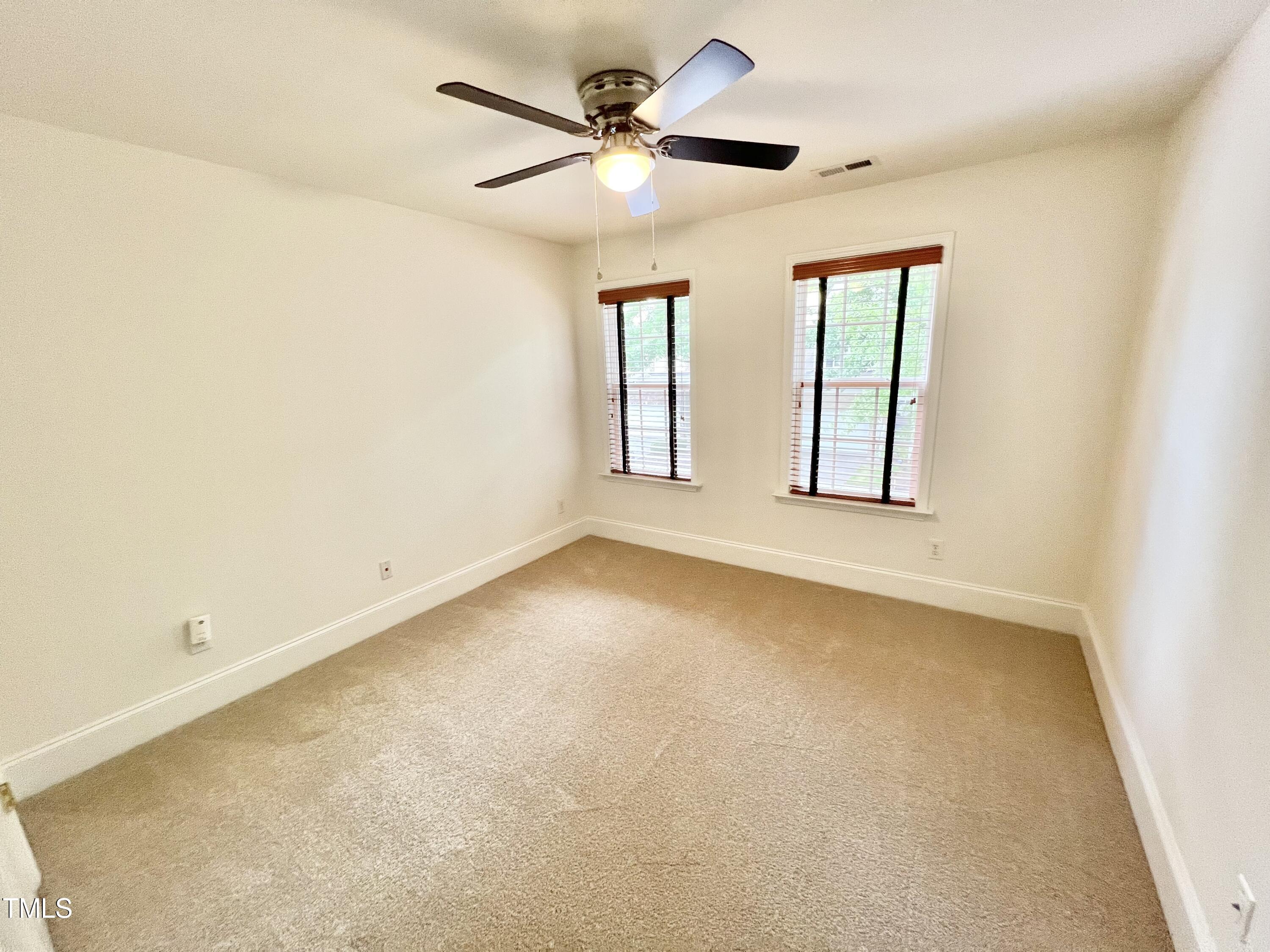 12221 Fox Valley Street Raleigh, NC 27614 - Photo 28 of 29 a view of an empty room with a window