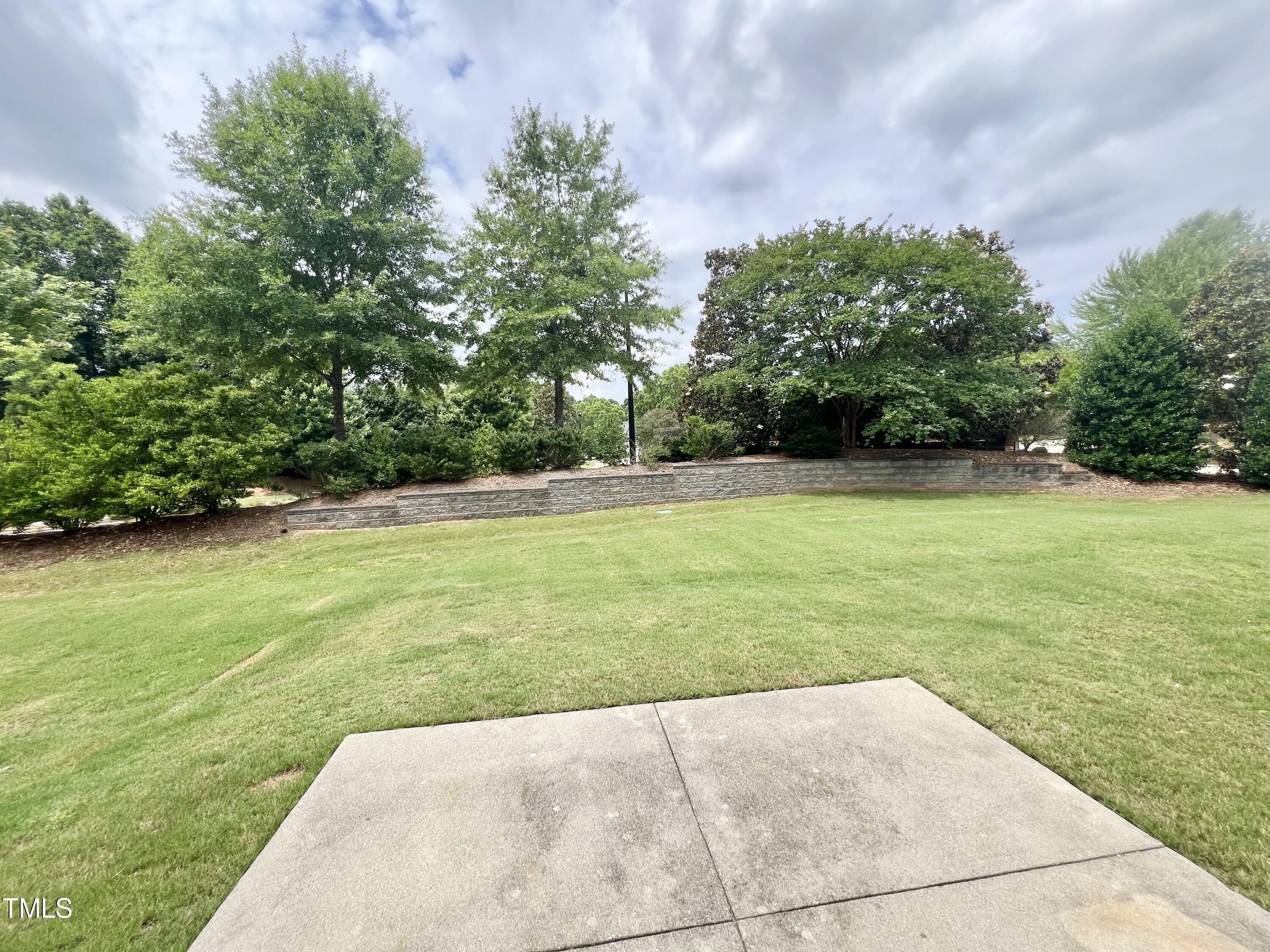 12221 Fox Valley Street Raleigh, NC 27614 - Photo 29 of 29 a view of a field with an trees in front of it