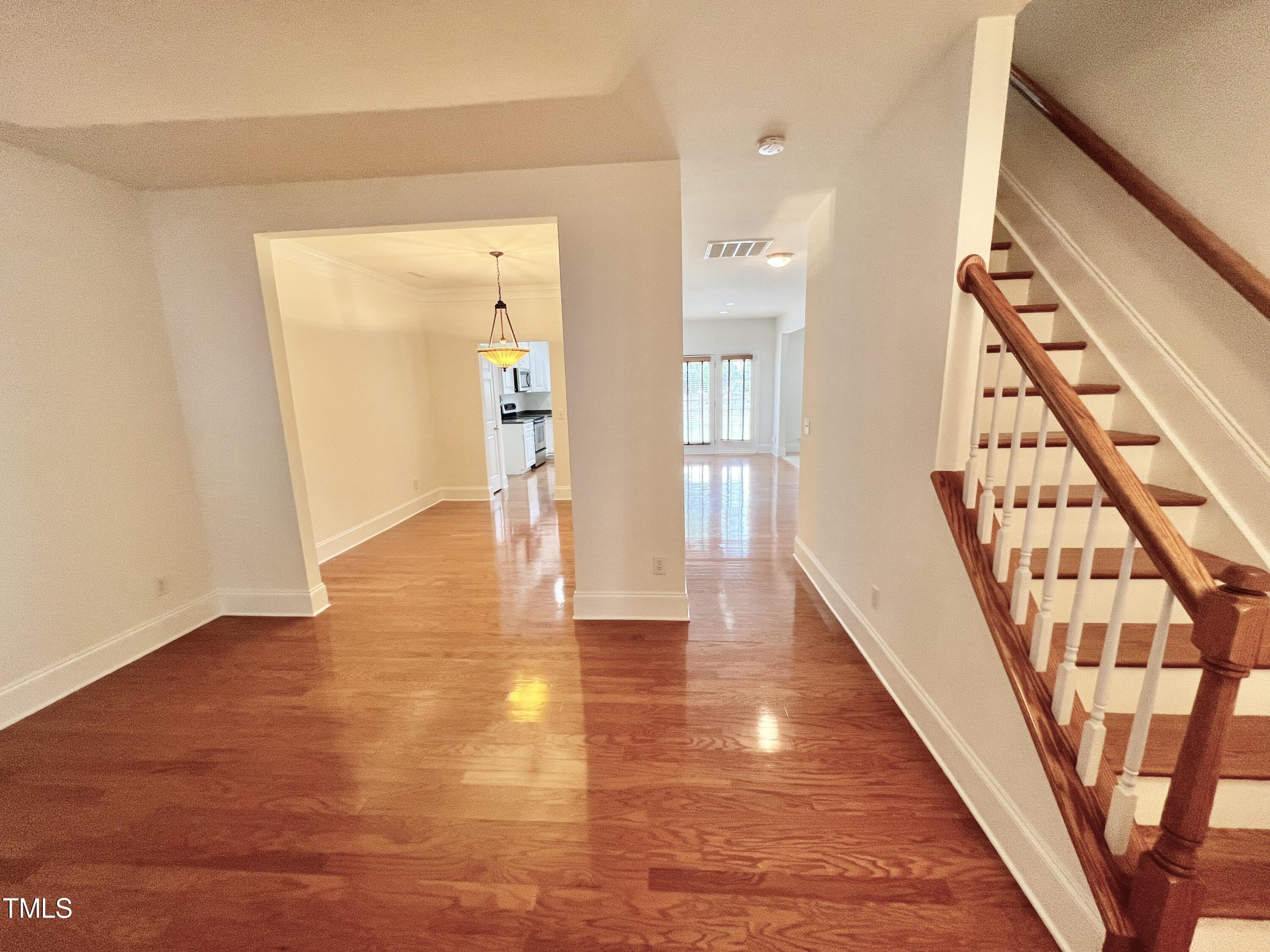 12221 Fox Valley Street Raleigh, NC 27614 - Photo 5 of 29 a view of an entryway with wooden floor
