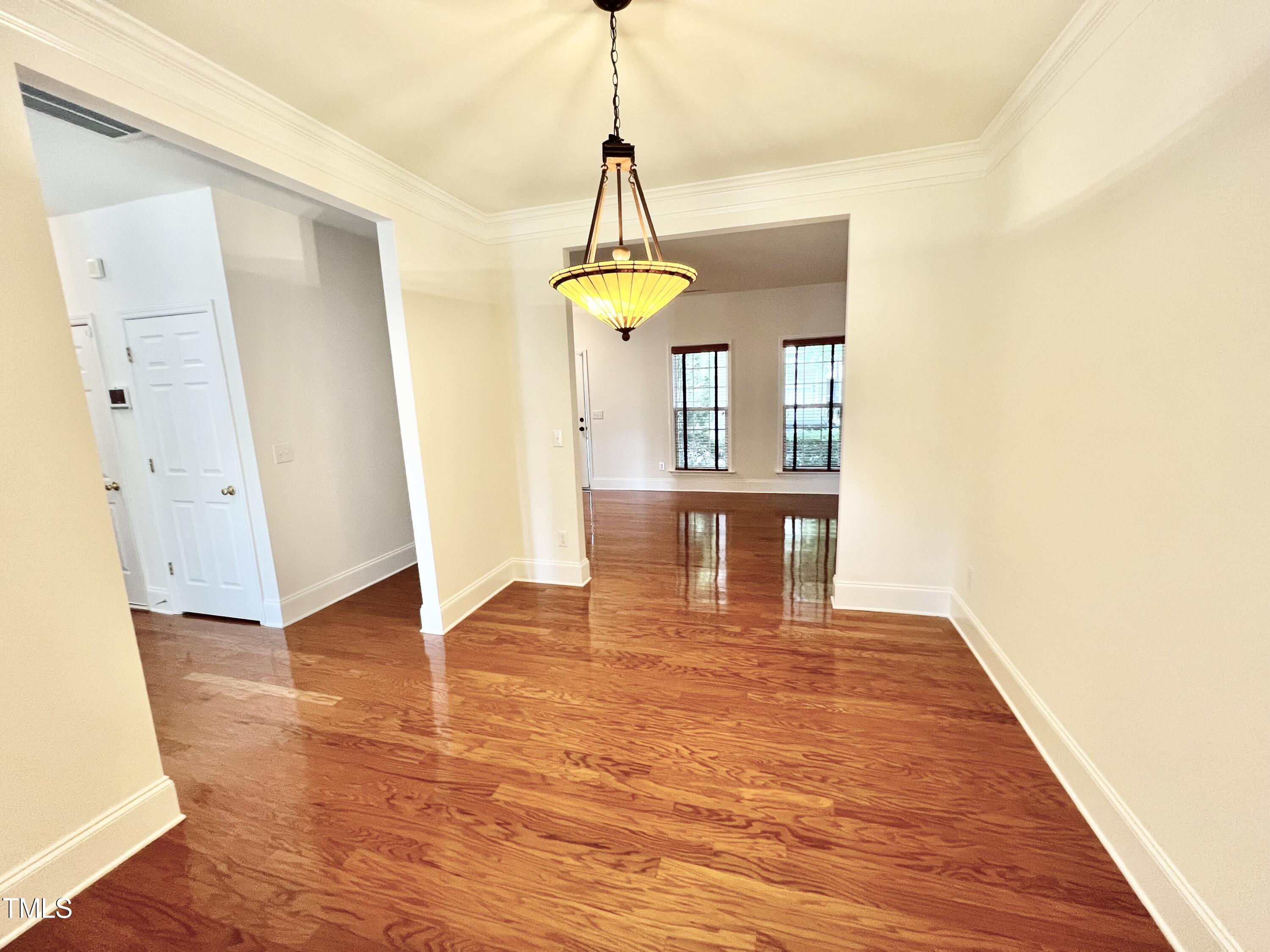 12221 Fox Valley Street Raleigh, NC 27614 - Photo 9 of 29 a view of a room with wooden floor and windows