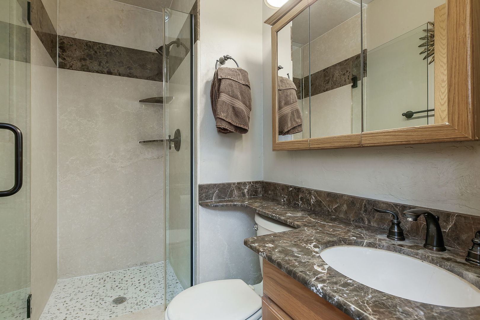 421 North Braintree Drive Schaumburg, IL 60169 - Photo 18 of 23 a bathroom with a granite countertop toilet sink and mirror