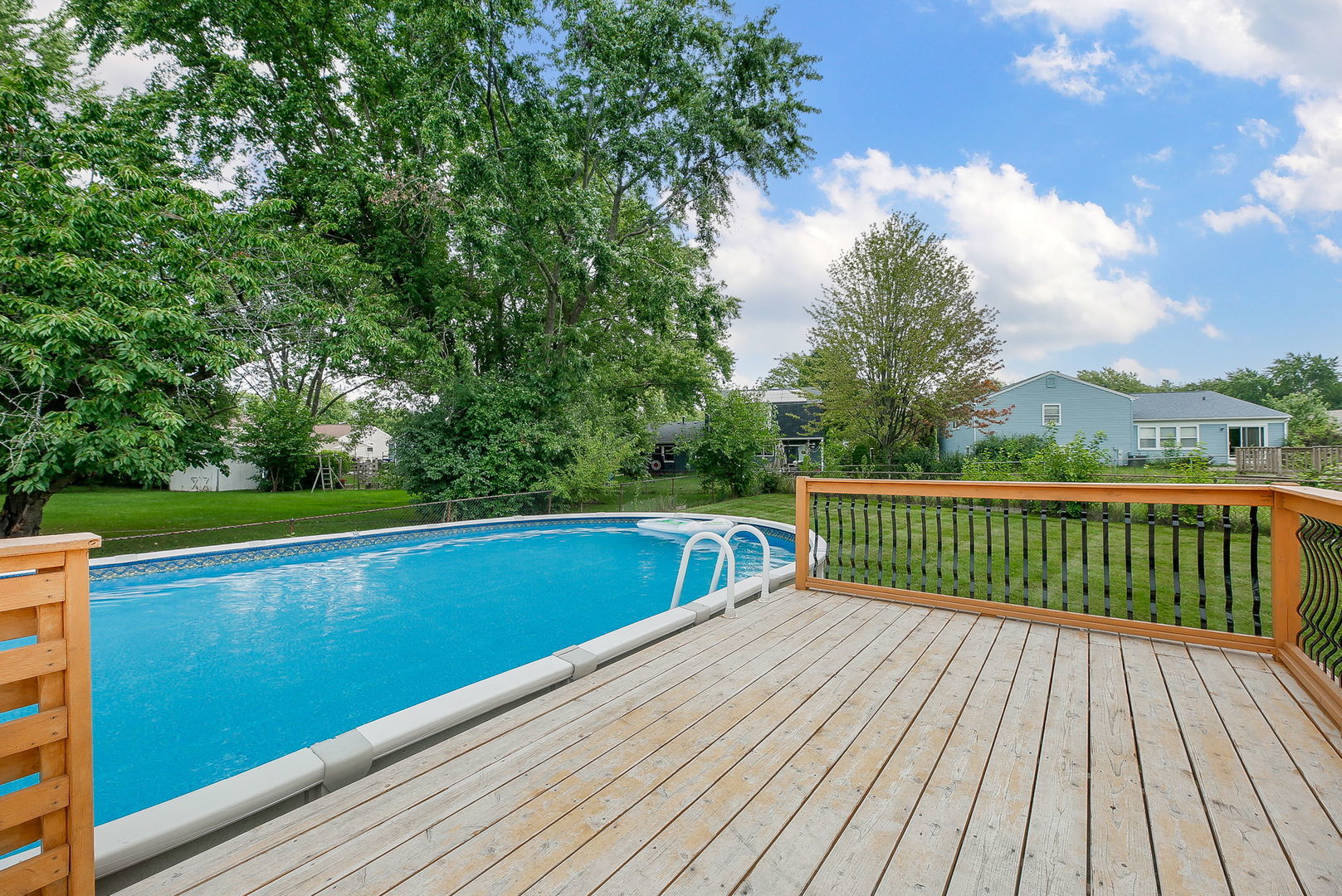 421 North Braintree Drive Schaumburg, IL 60169 - Photo 4 of 23 a view of a balcony with wooden floor and fence