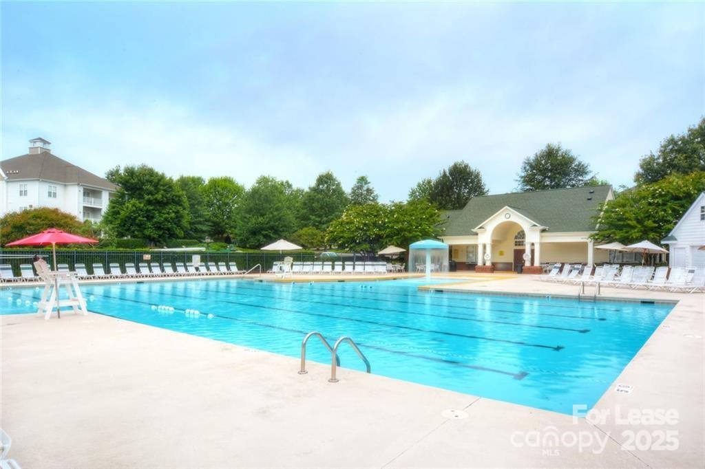 17905 Delmas Drive, Unit 101 Cornelius, NC 28031 - Photo 14 of 17 a view of a swimming pool with a patio