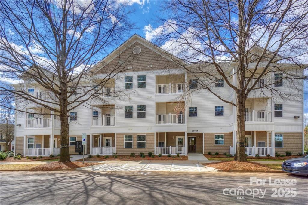 17905 Delmas Drive, Unit 101 Cornelius, NC 28031 - Photo 2 of 17 a front view of a building with street view