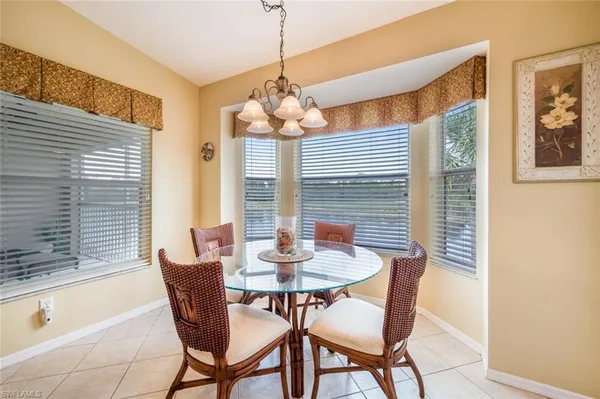 a dining room with furniture and window