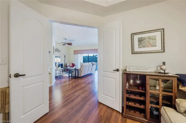 a view of a livingroom with furniture and hardwood floor
