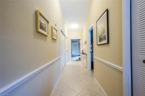 a view of a hallway with hallway and a bathroom