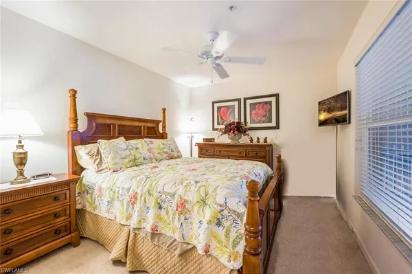 a bed room with a bed and a night stand