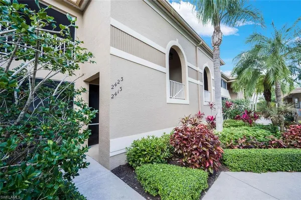 a flower plants in front of a house