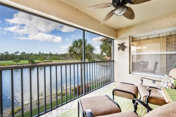 a view of a balcony with furniture
