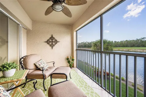 a view of a balcony dining table and chairs