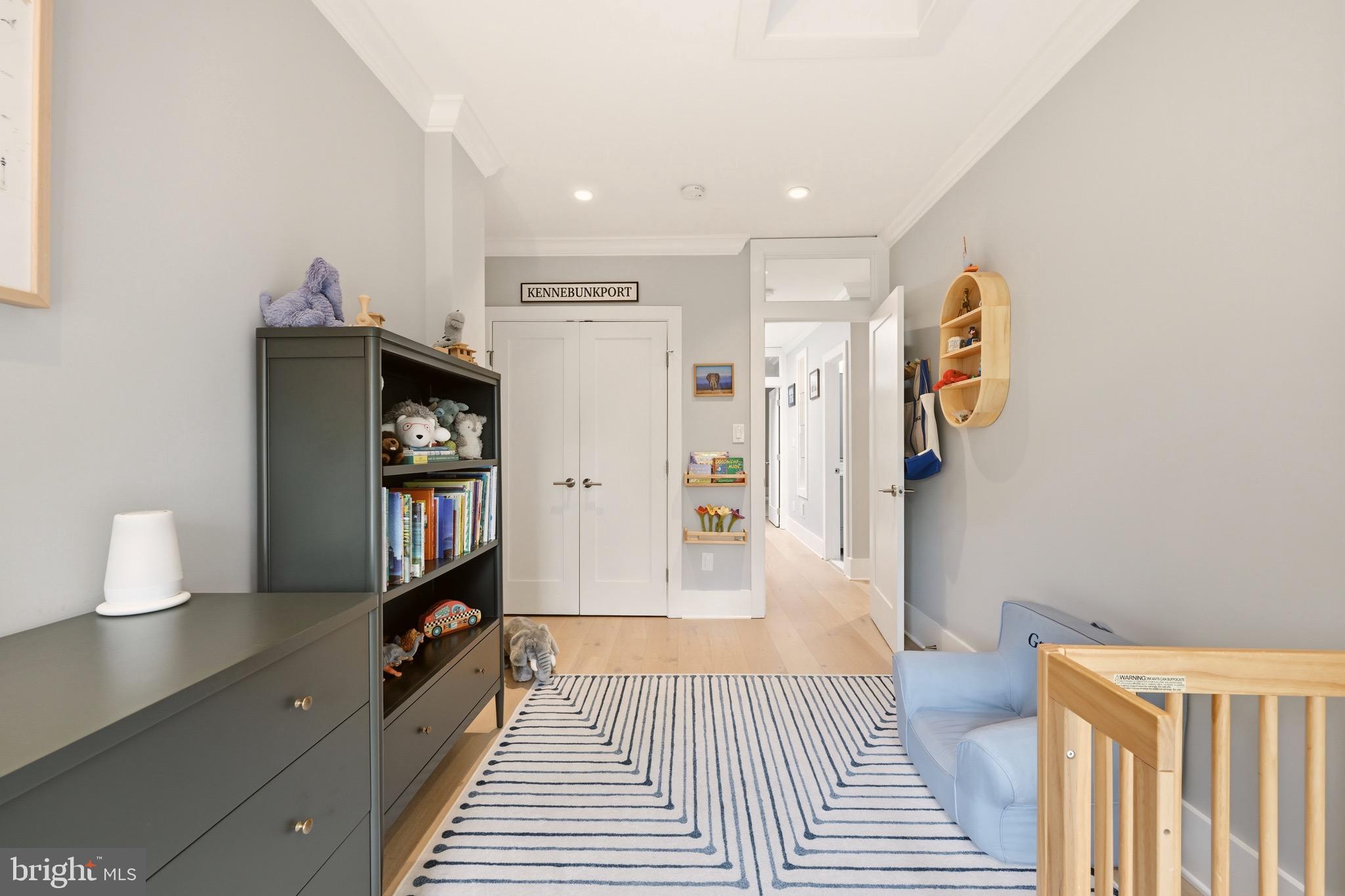 1705 Bay Street Southeast Washington, DC 20003 - Photo 24 of 29 a hallway with wooden floor and book shelf